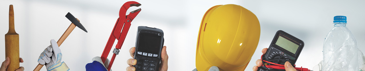 photo of various industry tools, such as a hard hat, wrench, cooking roller, measurement tools, and plastic bottles for recycling