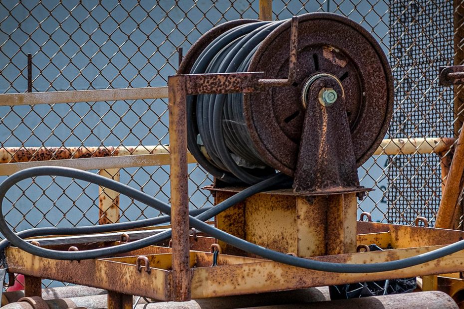 blog photo of a large industrial hose reel, heavily rusted