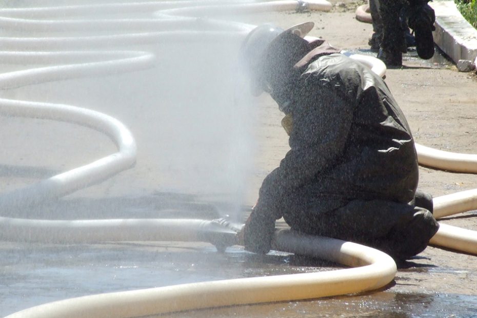 photo of worker repairing a hose accident